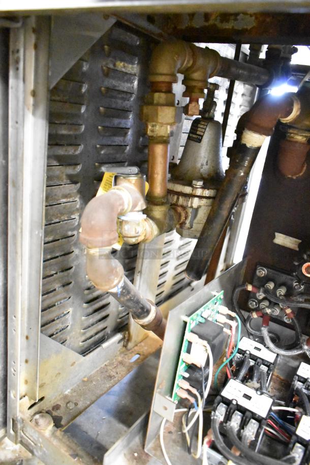 Cleveland Commercial 2 Deck Pressure Steam Cabinet, featuring internal plumbing and electronic controls. Condition appears used.