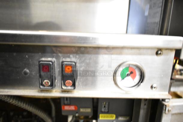 Cleveland Commercial 2 Deck Pressure Steam Cabinet with control buttons and pressure gauge, showing signs of use.