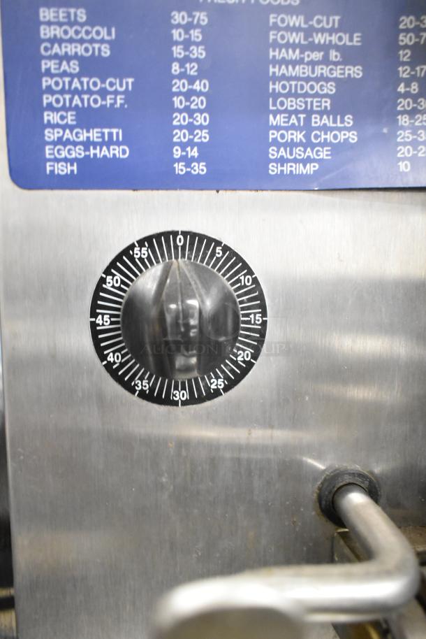 Cleveland commercial 2-deck pressure steam cabinet with timer dial and cooking chart, stainless steel, used condition.