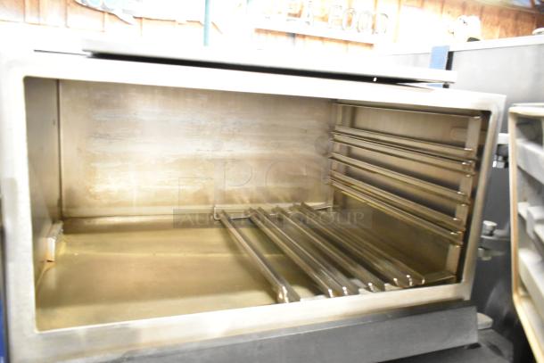 Cleveland Commercial 2 Deck Pressure Steam Cabinet, stainless steel interior, clean condition, ideal for high-capacity kitchens.