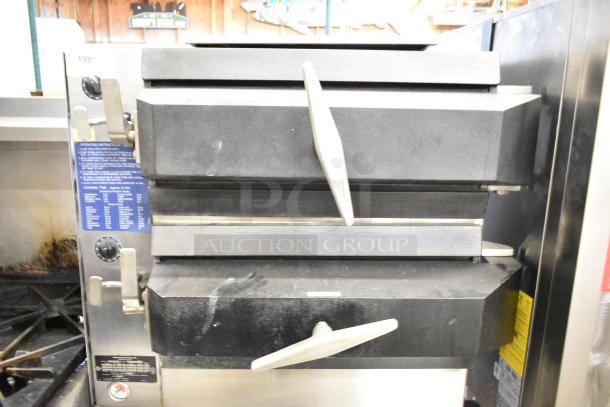 Cleveland Commercial 2 Deck Pressure Steam Cabinet, stainless steel, dual handles, visible operating instructions label, good condition.