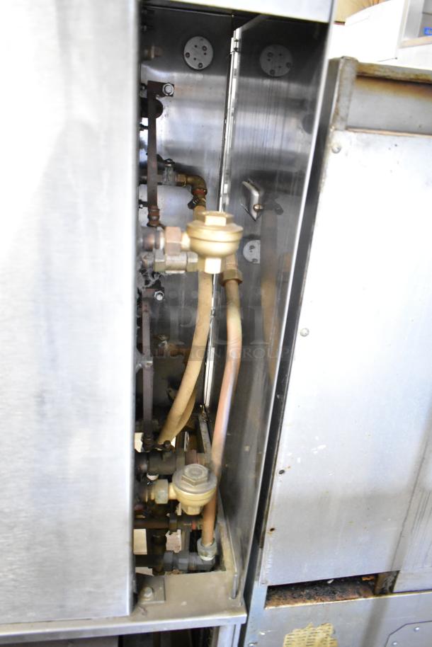 Cleveland Commercial 2 Deck Pressure Steam Cabinet, stainless steel, visible internal piping, used condition.