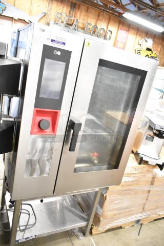 BRAND NEW SCRATCH AND DENT! BKI AETG101R Stainless Steel Commercial Natural Gas Powered Combi Convection Oven on Equipment Stand.