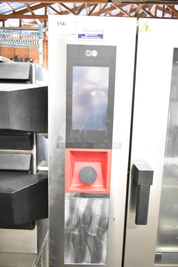 BKI AETG101R stainless steel combi convection oven, brand new with slight dents, on equipment stand. Touch control panel visible.
