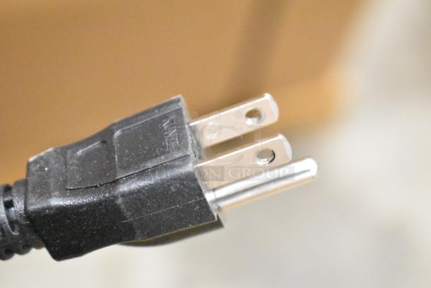 Close-up of a 120-volt plug for the Bunn WAVE15-S-APS coffee brewer, new condition with minor scratches and dents visible.