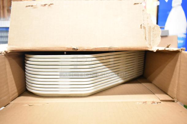 55 new Cambro 1422TR526 14"x22" trapezoid trays in Galaxy Gold Antique Parchment, shown in opened box. Scratch and dent condition.