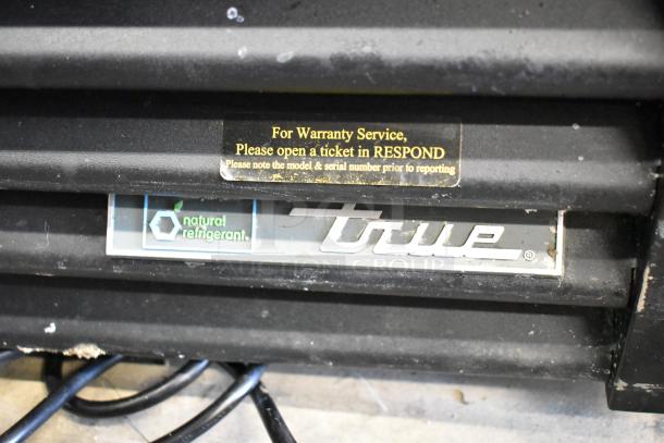 2020 True GDM-49-HC Commercial Cooler; warranty and refrigerant labels; model identifier and brand logo.