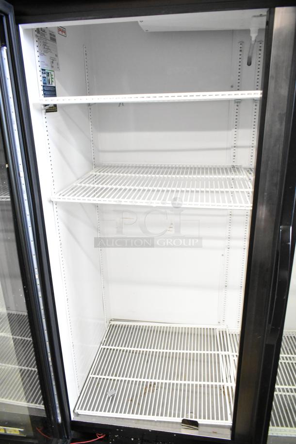 2020 True GDM-49-HC commercial reach-in cooler, two glass doors, three white wire shelves, 115V, 1 phase, excellent condition.