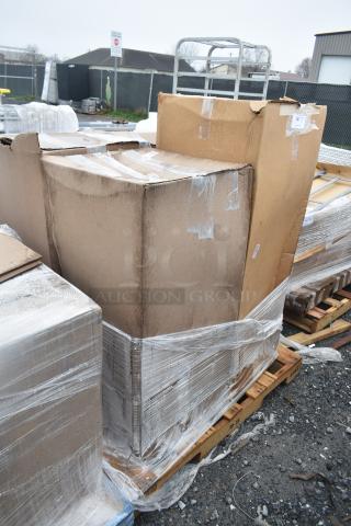 Pallet with four brand new scratch and dent items, including Lancaster Table & Seating Stool, wrapped in plastic.