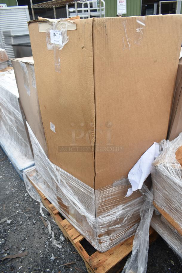 Cardboard box with shipping tape and pallet wrap, containing 4 new scratch and dent items including Lancaster Table & Seating Stool.