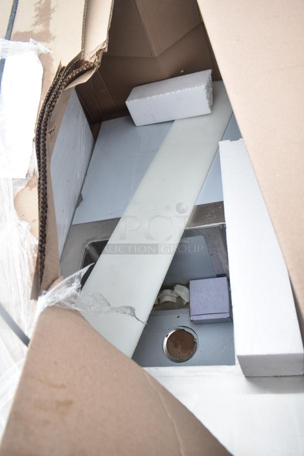 Brand new scratch and dent unit in open box, visible protective packaging, and minor cosmetic imperfections.