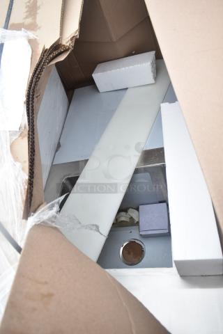 Brand new scratch and dent unit in open box, visible protective packaging, and minor cosmetic imperfections.