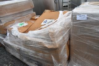 Pallet of six new scratch-and-dent items including a sink, wrapped in plastic and cardboard, labeled “165/” with quantity note.