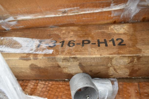 Box with "316-P-H12" marking containing a scratch and dent item lot, including a new sink. Packaging looks slightly worn.