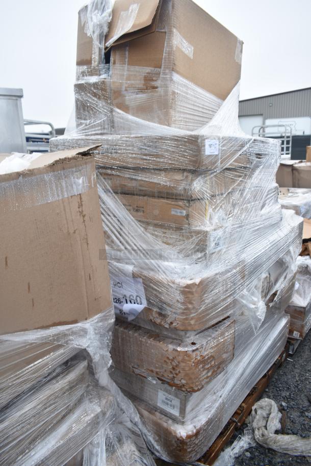 Pallet of 11 new scratch-and-dent items, including work tables, wrapped in plastic. Boxes show wear with labels indicating lot MAR26-160.