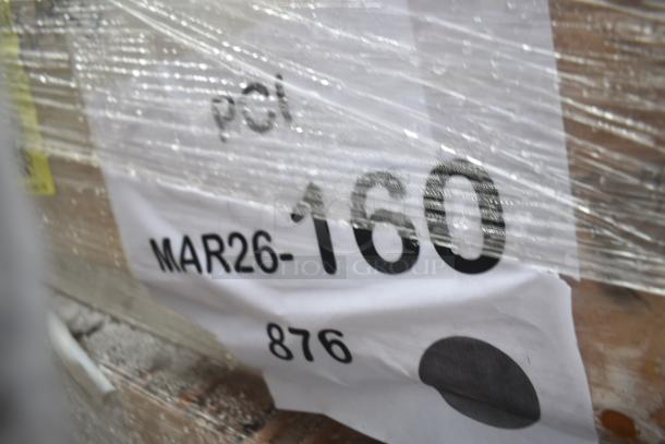 Plastic-wrapped packaging with printed label showing "MAR26-160," indicating auction lot of scratch and dent work tables.