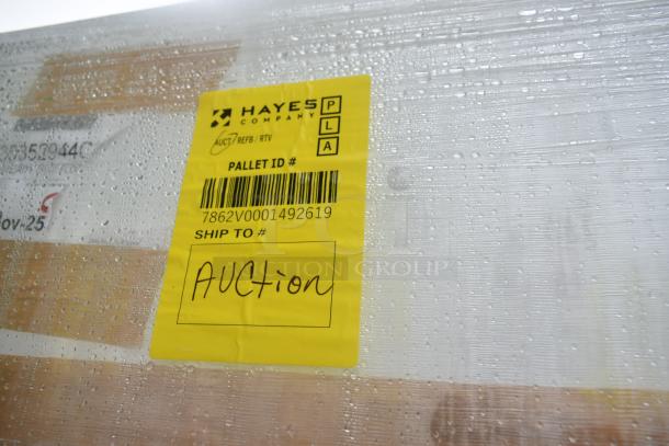 BRAND NEW SCRATCH AND DENT 35352944C052 Security Case Floor with Grid, wrapped in plastic, yellow shipping label for auction.