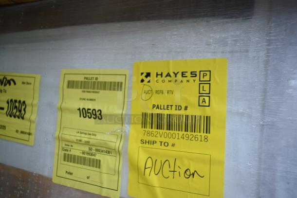 BRAND NEW SCRATCH AND DENT! Hayes security case floor with grid. Yellow tags indicate "Auction" and "Pallet ID #10593".