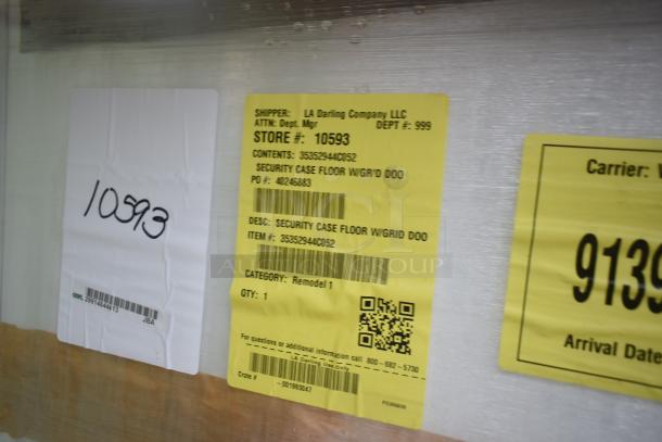 Yellow shipping label on security case showing details: Shipper LA Darling Company LLC, Store #10593, PO #40248883, Item #35352944C052.