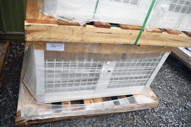 Brand new 35352944C052 security case, floor model with grid, minor scratch and dent, on wooden pallet, wrapped in plastic.