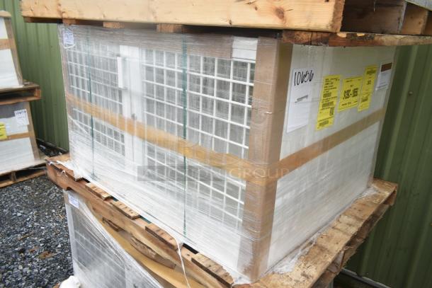 Brand new scratch and dent security case with grid, model 35352944C052, wrapped on a wooden pallet with visible tags.