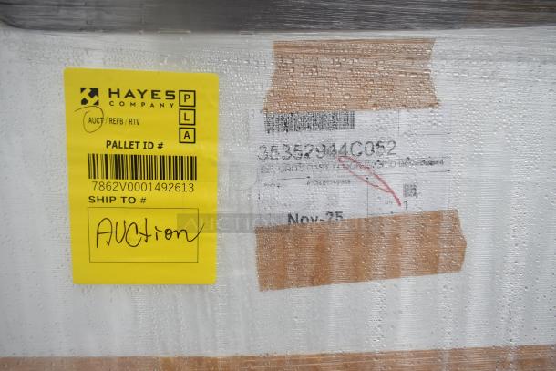 BRAND NEW SCRATCH AND DENT 35352944C052 Security Case Floor with Grid. Pallet labeled for auction, Hayes Company tag shown.