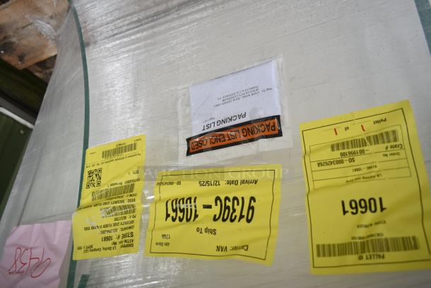 Brand new scratch and dent security case floor with grid, model 35352944C052, shipping labels visible.