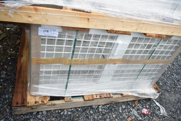 Brand new security case floor with grid, model 35352944C052, wrapped on wooden pallet, minor scratches visible.