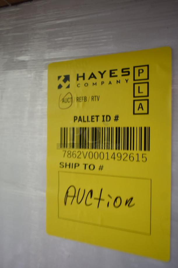 Yellow tag on security case, "Hayes Company," barcode, "AUCTION" handwritten. Item ID: 35352944C052. New, scratch and dent condition.