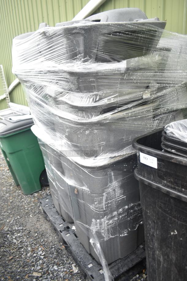 Stack of 9 gray poly trash cans on a pallet, wrapped in plastic. Item labeled "177," indicating auction lot.