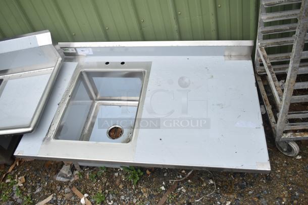 Brand new Regency 600ST3048L commercial counter with single bay sink, visible scratch and dent, label reads "181", no legs included.