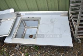 Brand new Regency 600ST3048L commercial counter with single bay sink, visible scratch and dent, label reads "181", no legs included.