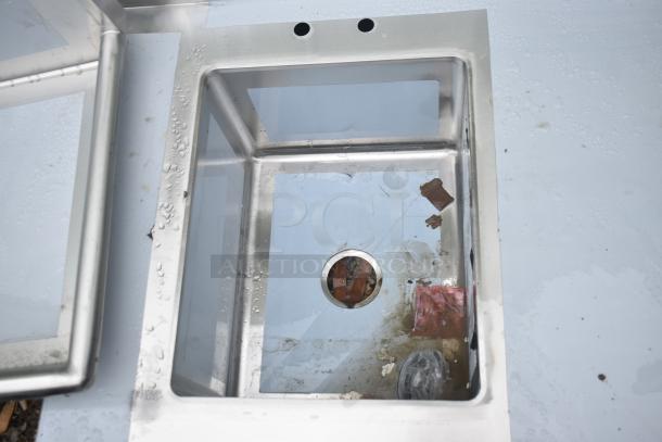 BRAND NEW SCRATCH AND DENT Regency 600ST3048L Commercial Sink without legs, featuring a single bay and visible imperfections.