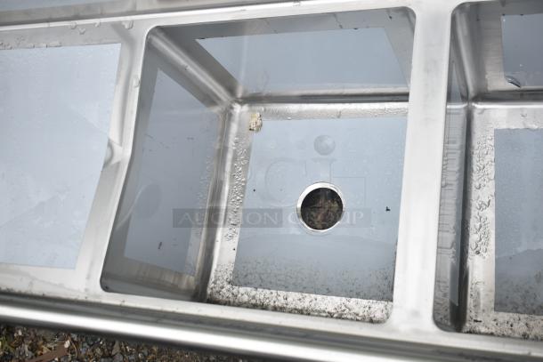 Brand new Regency 600S31818218 stainless steel commercial sink, 3 compartments, 16 gauge, 2 drainboards, no legs.