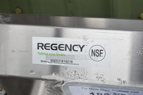 Brand new Regency 600S31818218 stainless steel sink, 94" 16-gauge, three compartments, cross bracing, 2 drainboards, no legs, NSF label.