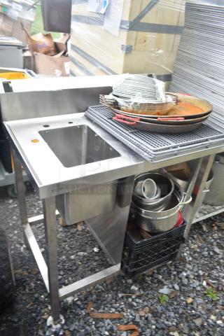 Single stainless steel bay sink with various skillets on top, includes cookware in lower storage. Used condition.