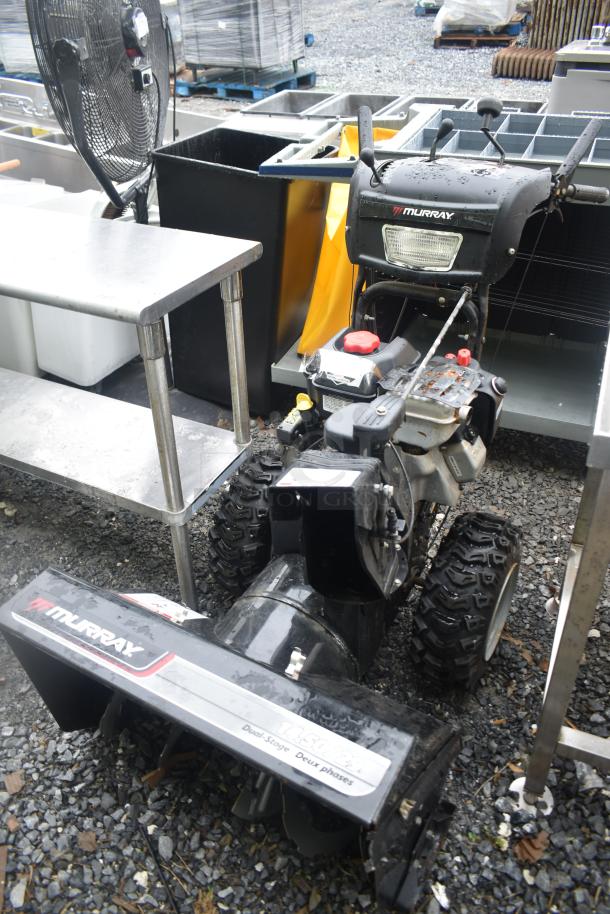 Briggs & Stratton Murray 1695720 Snow Thrower; dual-stage, visible Murray branding, used condition, sturdy tires.