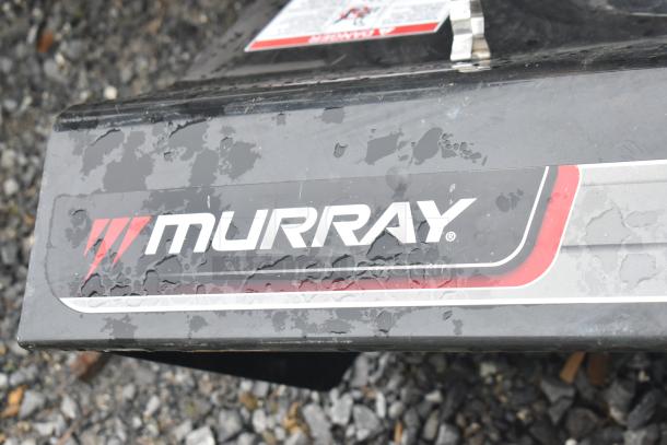 Briggs & Stratton Murray 1695720 snow thrower, black with visible Murray logo, in used condition.