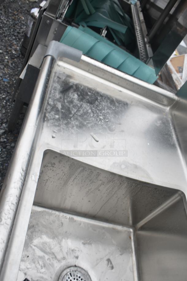 Commercial 3 Bay Sink with Dual Drain Boards, stainless steel, lightly used, features visible water stains and scuffs.