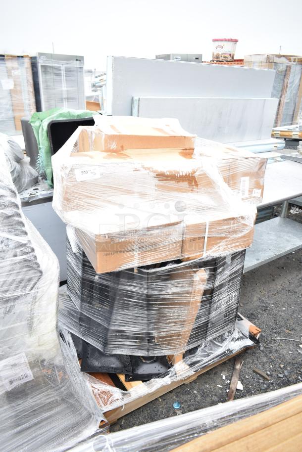 Pallet with 20 new scratch and dent items including table bases, wrapped in plastic. Auction tag visible.