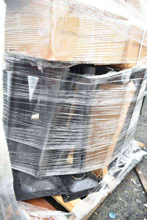 Pallet of 20 scratch and dent items, including table bases, wrapped in plastic. Brand new condition, some minor marks.