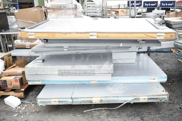 Arctic 36x75 Walk In Box components, stacked. Condition appears used with visible wear on panels; latches intact.