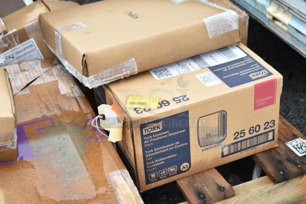 Box of Tork 256023 Air Freshener Dispenser, new condition, visible labels and package markings.