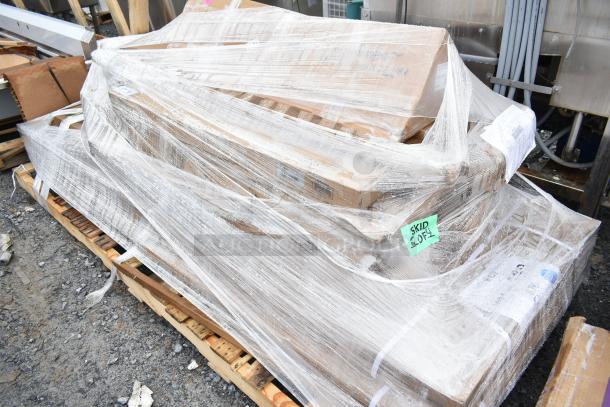 Eight brand new scratch and dent items on pallet, shrink-wrapped. Includes model K03000819PKG. Skid labeled "SKID 104".