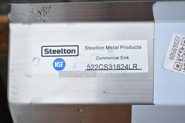 Brand new Steelton 522CS31824LR commercial 3-bay sink in stainless steel. Includes dual drain boards, minor scratches, and no legs. NSF certified.