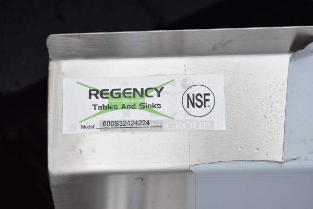 "Regency 600S32424224 commercial 3 bay sink, dual drain boards, stainless steel, scratch and dent, NSF certified tag visible."