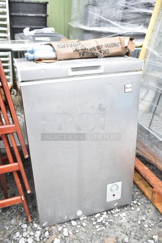 Stainless steel chest freezer, 115 volts, 1 phase, front temperature control, Amana logo. Used condition.