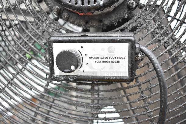 Floor style fan with a speed regulator knob; 115 volts, 1 phase. Visible wear on blades; dial labeled 0-3.