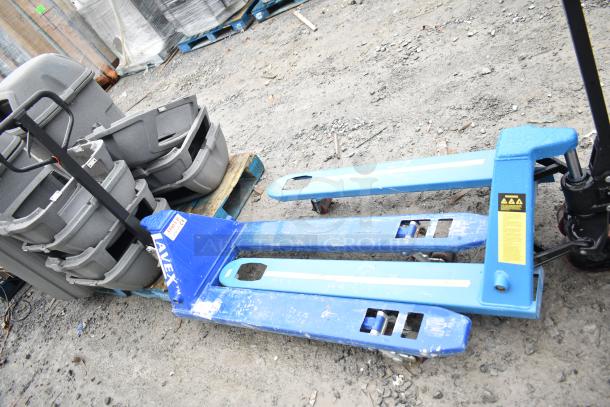 Lavex Commercial pallet jack, 5,500 lb capacity, blue, well-used. Visible brand label and safety instructions sticker.
