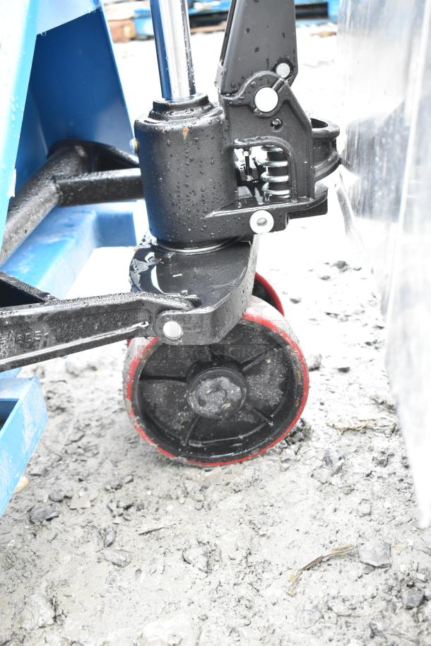 2 Lavex Commercial 5,500 lb pallet jack, sturdy black and blue frame, wheel detail, lightly used condition.